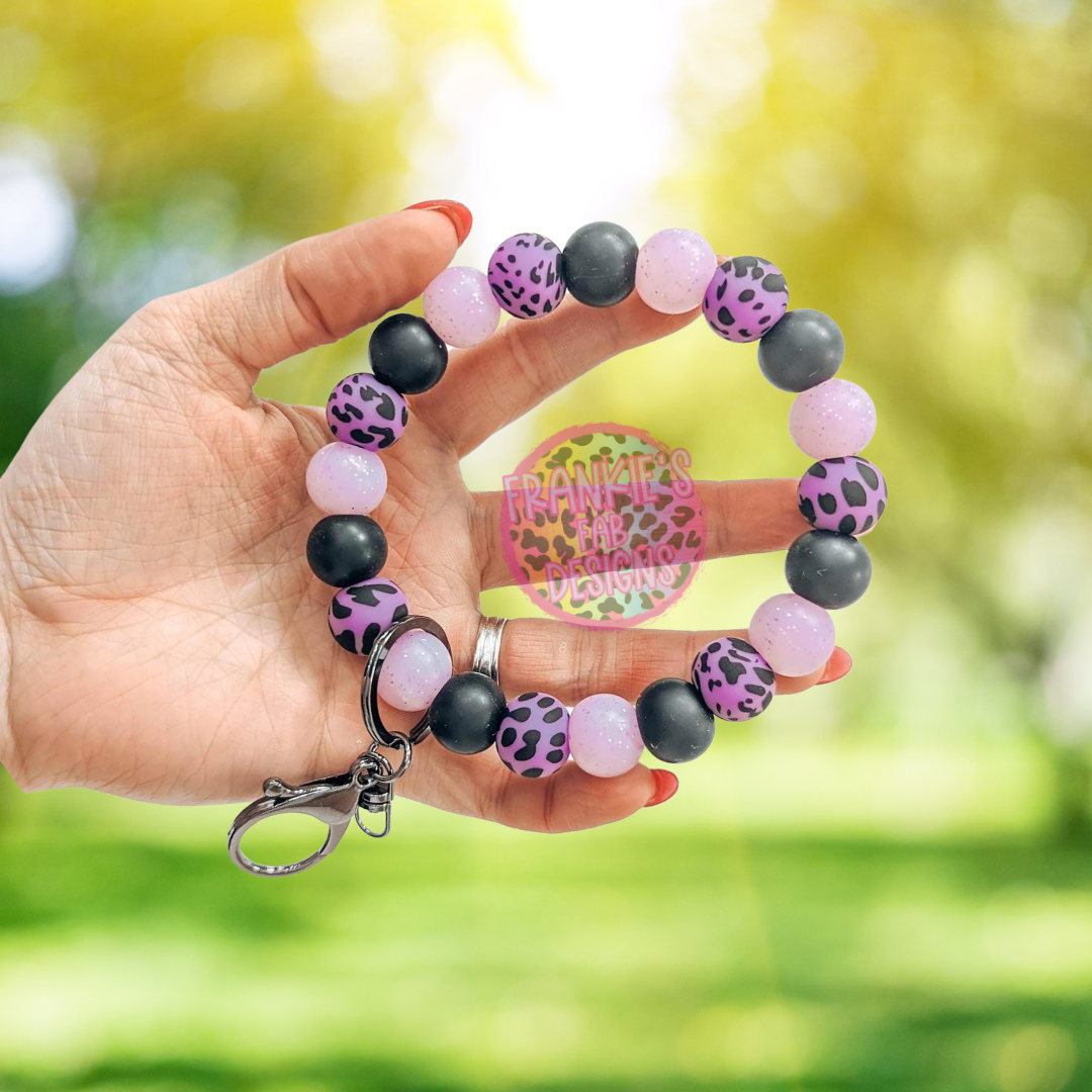 Porte-clés en silicone avec bracelet en vache violette