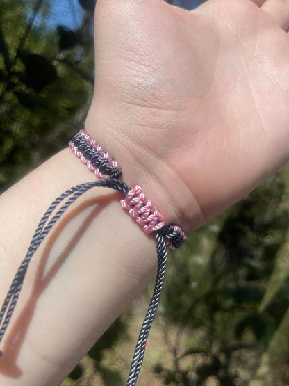 Pink slide clasp of the grey and pink batman bracelete